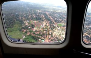 Photo of a city from above, looking out of an airplane window