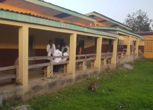 Photo of the Boende vaccine trial site with people talking